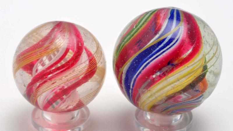 Appraisal: Lot of Complex Core Swirl Marbles Description The smaller marble