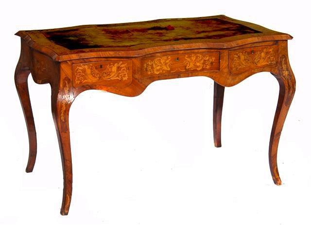 Appraisal: A TH CENTURY FRENCH SERPENTINE WRITING TABLE fitted one long