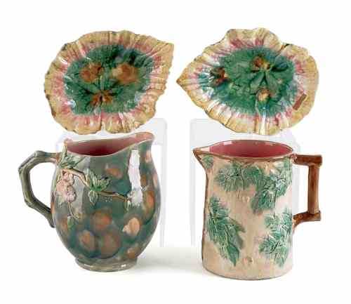 Appraisal: Two Etruscan majolica pitchers h and h together with two