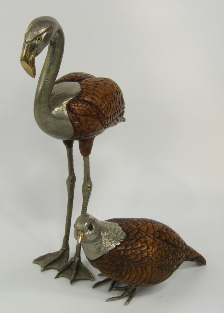 Appraisal: A composite and white metal figure of a partridge inset