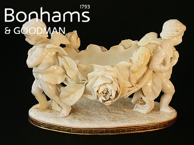 Appraisal: A Moore Brothers lotus shaped jardini re modelled supported by