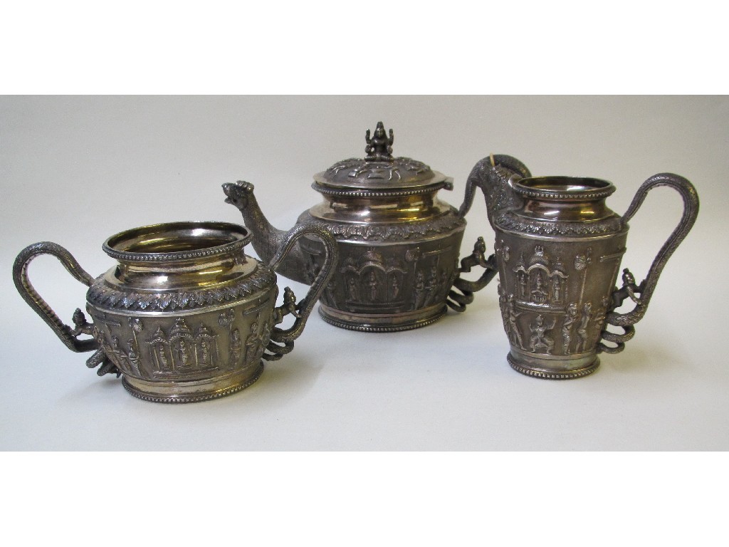 Appraisal: A Madras white metal embossed three piece tea service decorated