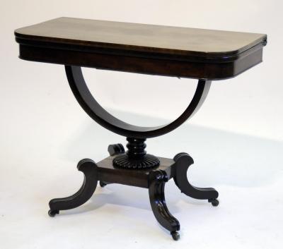 Appraisal: A MAHOGANY FOLDING TEA TABLE of rounded oblong form the