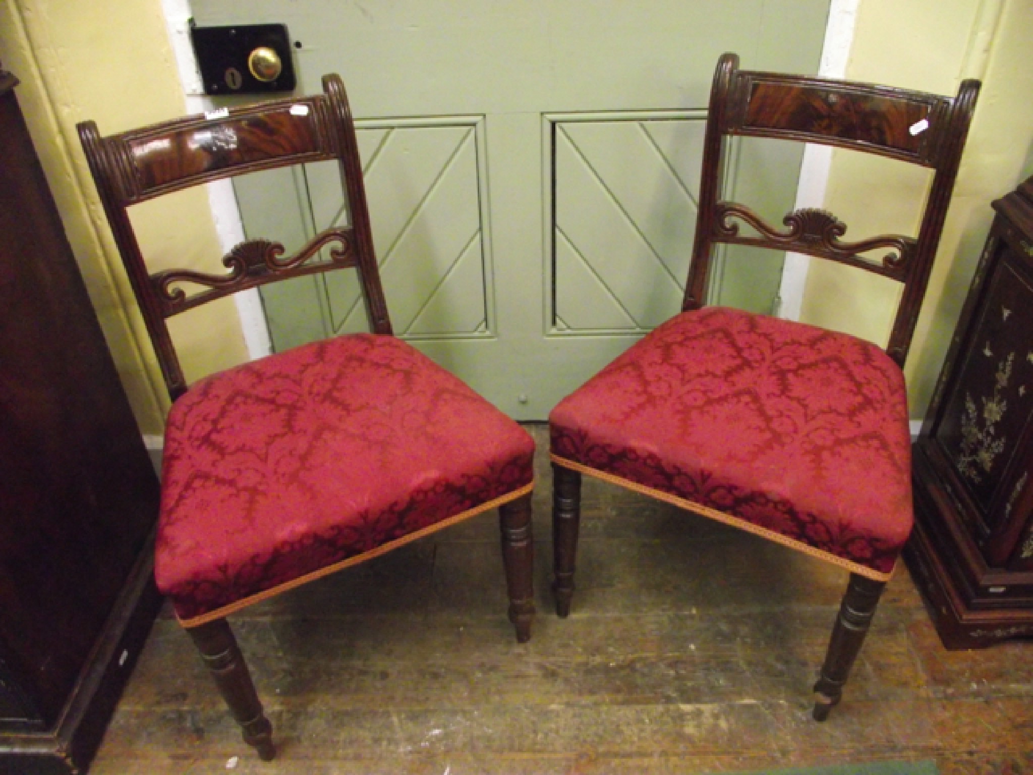 Appraisal: A pair of Regency mahogany dining chairs with carved and