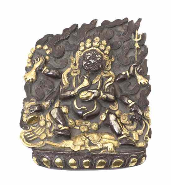 Appraisal: A Tibetan Silver Model of Mahakala the Buddhist protector depicted