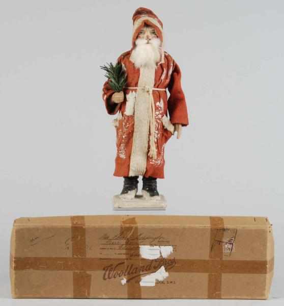 Appraisal: German Santa Candy Container in Box Description Wearing a red