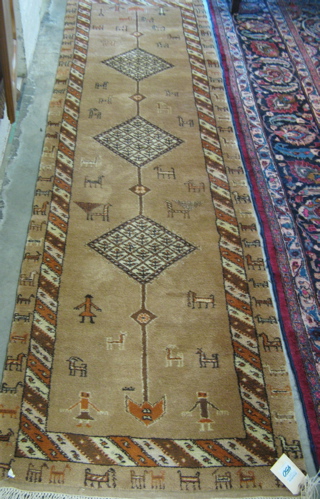 Appraisal: PERSIAN RUNNER hand knotted in a pattern comprising three diamond-shaped