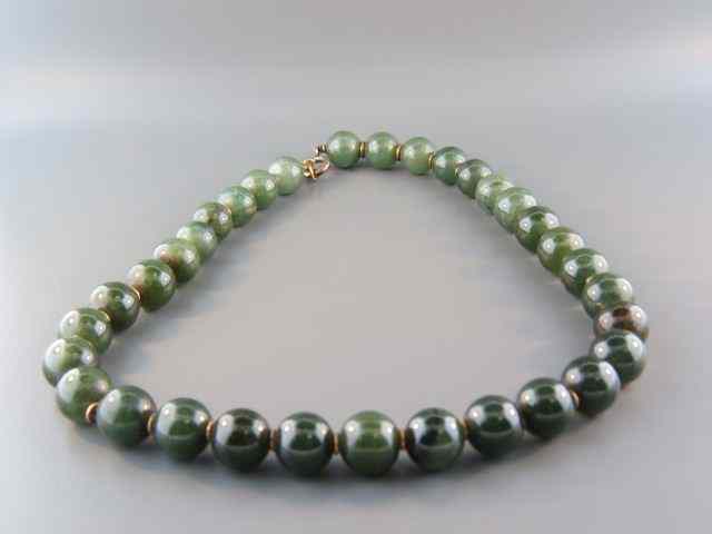 Appraisal: Jade Necklace to mm beads to mm beads deep spinach