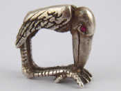 Appraisal: A white metal tests silver ring designed as a pelican