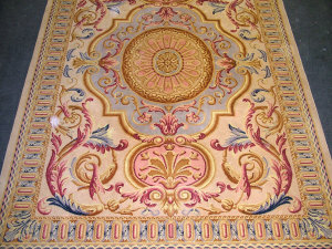 Appraisal: A machine made carpet in Louis XVI style with circular