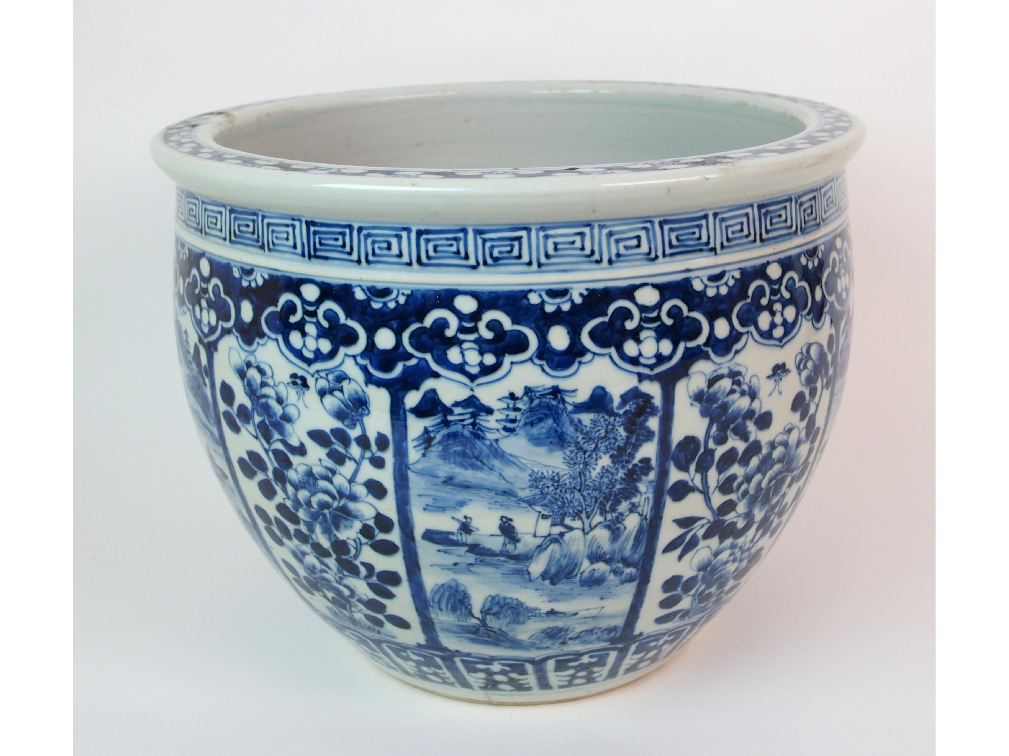 Appraisal: A Chinese blue and white jardinierepainted with panels of landscapes