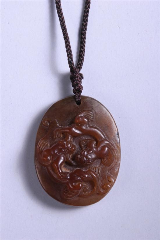 Appraisal: CHINESE RHINOCEROS HORN PENDANT Carved to depict fu lion -