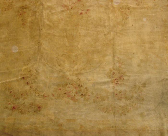 Appraisal: x Aubusson carpet beige floral sculptured design some holes and