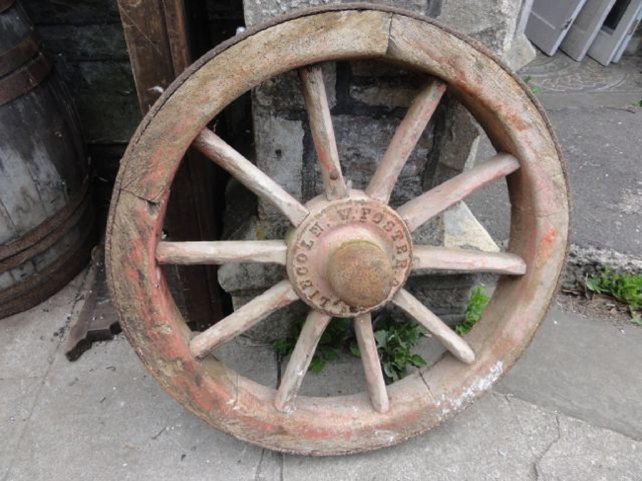 Appraisal: A vintage wooden spoke agricultural wheel with iron rim and