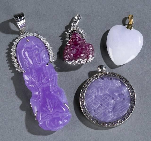 Appraisal: lavender jade and rubilite pendants A group of lavender jade