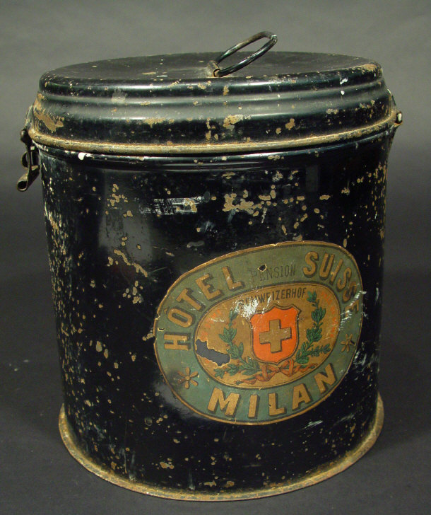 Appraisal: Cylindrical black metal tin and lid printed with a Hotel