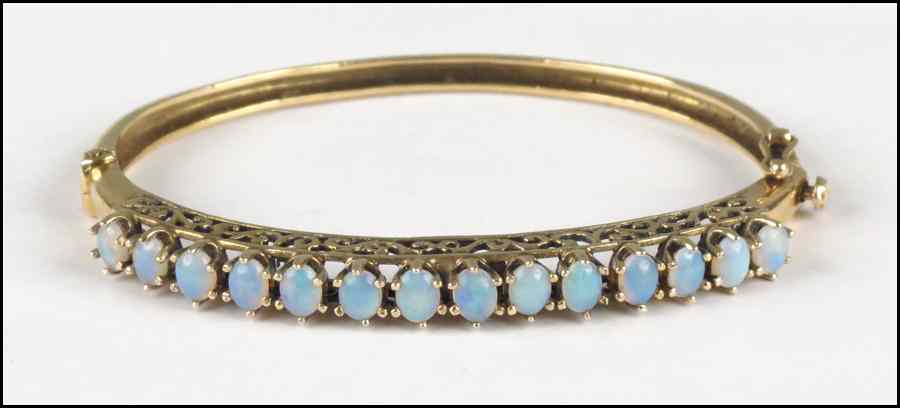 Appraisal: KARAT YELLOW GOLD AND OPAL BANGLE BRACELET grams Condition No