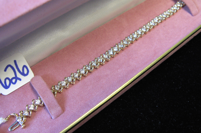 Appraisal: DIAMOND AND FOURTEEN KARAT GOLD BRACELET - inches and covered