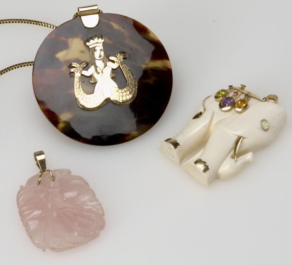 Appraisal: LARGE PENDANTS WITH GOLD MOUNTS Three pendants in k carved