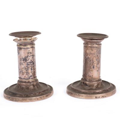 Appraisal: A pair of Victorian silver candlesticks Sheffield with cylindrical stems