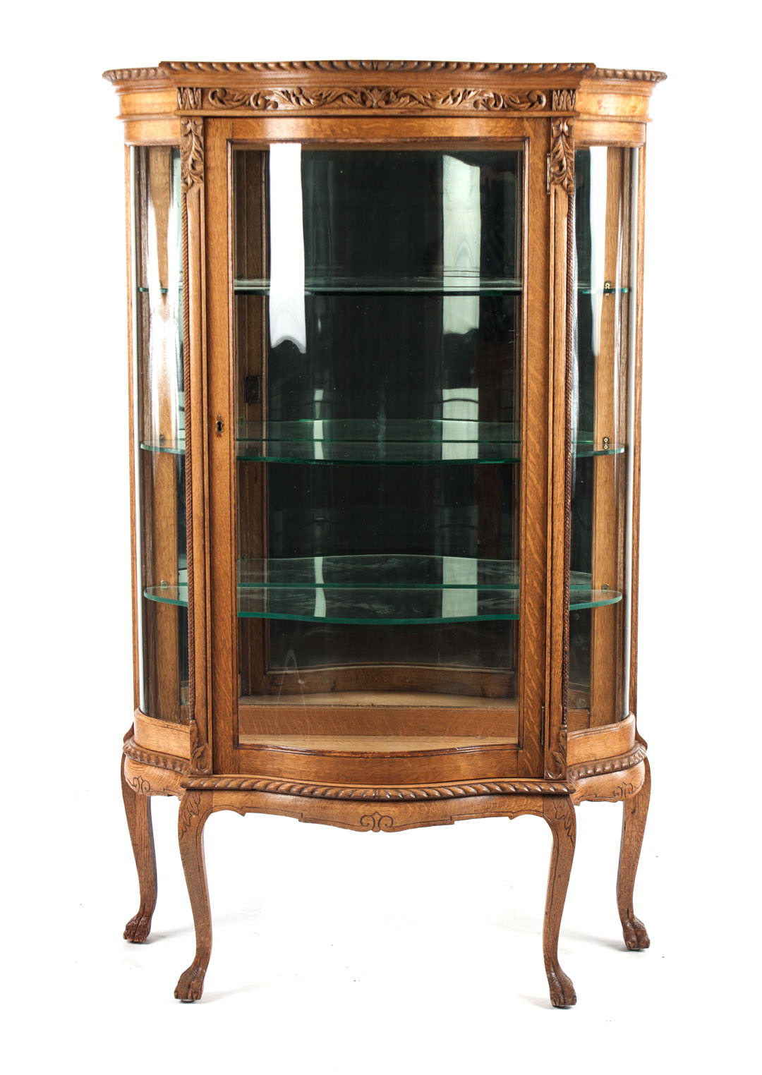 Appraisal: Victorian oak bow-front china cabinet late th century with carved