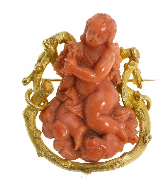 Appraisal: A FINE CORAL BROOCH carved as a cherub on clouds