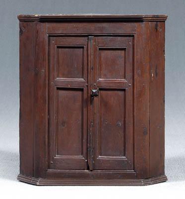 Appraisal: Diminutive hanging corner cupboard pine throughout with red stain two