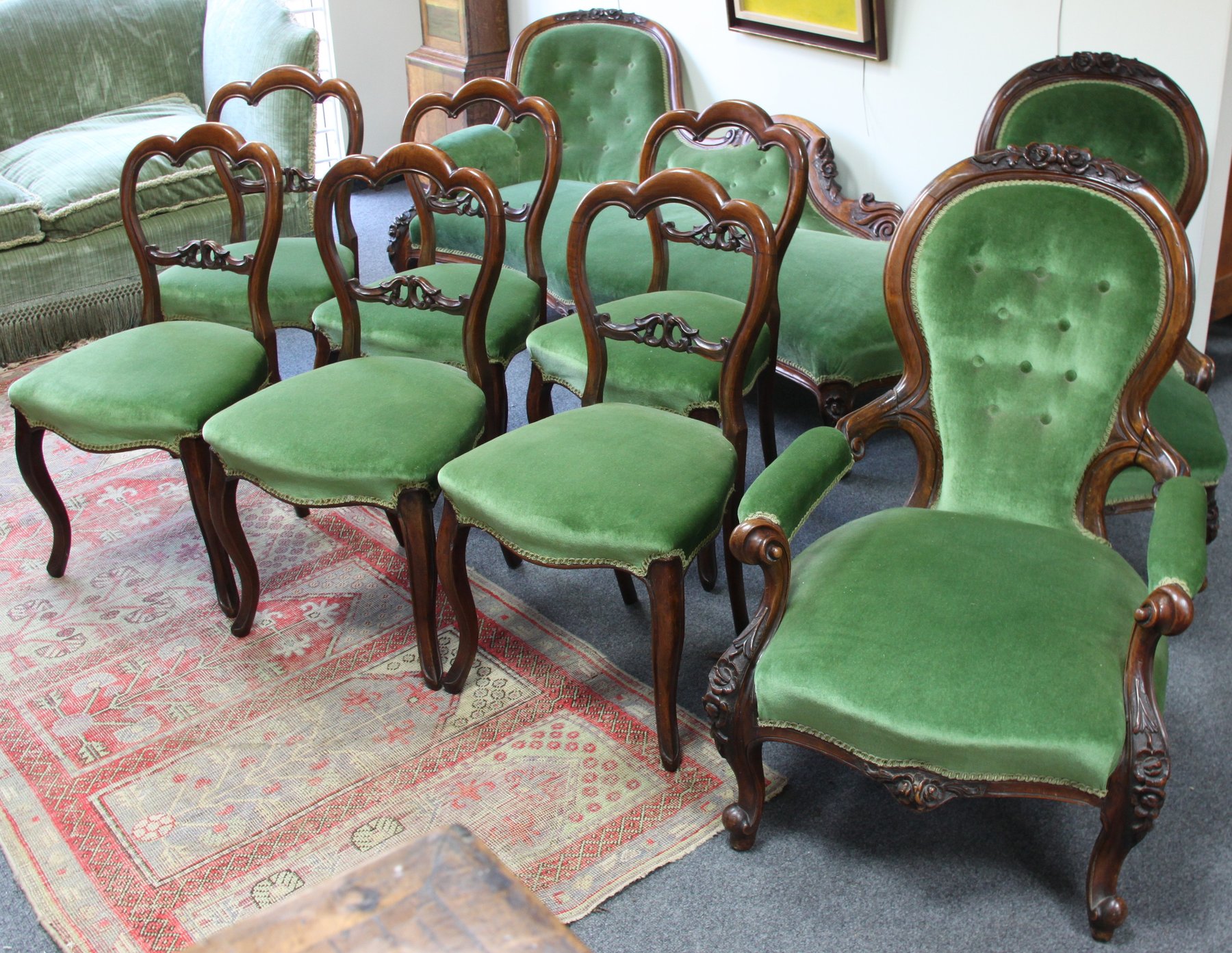 Appraisal: A Victorian walnut framed salon suite comprising chaise longue pair