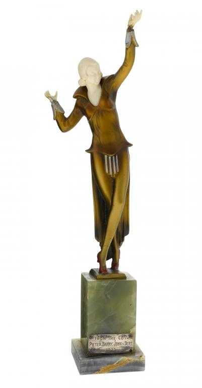 Appraisal: AN ART DECO BRONZE AND IVORY STATUETTE OF A YOUNG