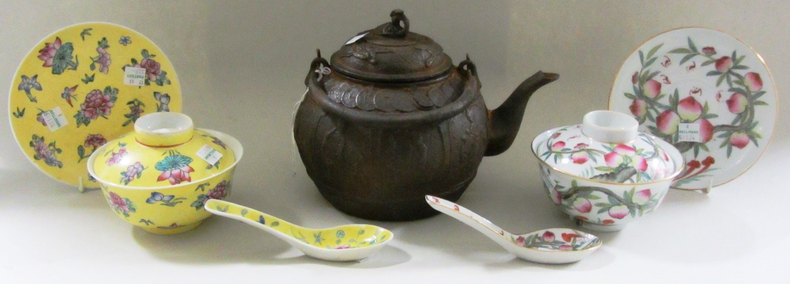 Appraisal: A Chinese cast iron kettle and cover the sides decorated