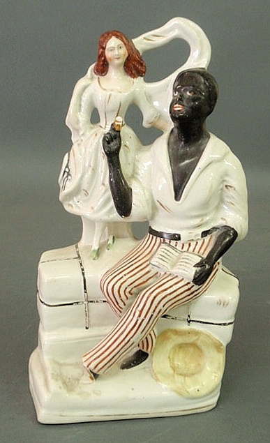 Appraisal: Staffordshire figure of Uncle Tom and Eva each with a