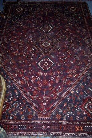 Appraisal: A large Caucasian rug with diamond shaped medallion on a