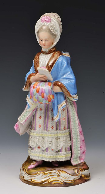 Appraisal: A MEISSEN PORCELAIN MODEL OF A 'GIRL WITH MUFF READING'