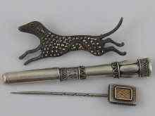 Appraisal: A silver and marcasite hound brooch marked a white and