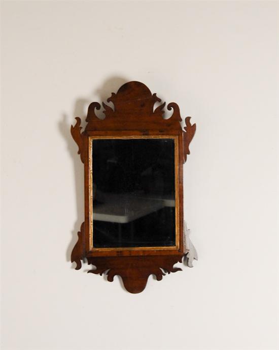 Appraisal: A Chippendale-style Looking Glass mahogany with string inlay carved and