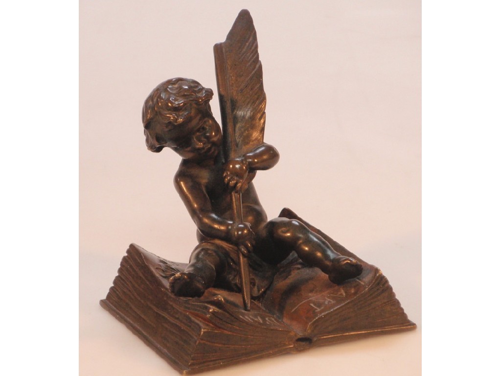 Appraisal: A thC French bronze figure of a seated putti with