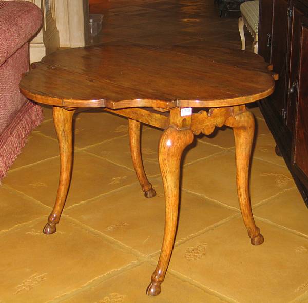 Appraisal: An Italian Rococo style walnut center table height in width