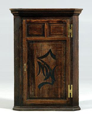 Appraisal: Georgian oak hanging corner cabinet three-panel door with painted monogram