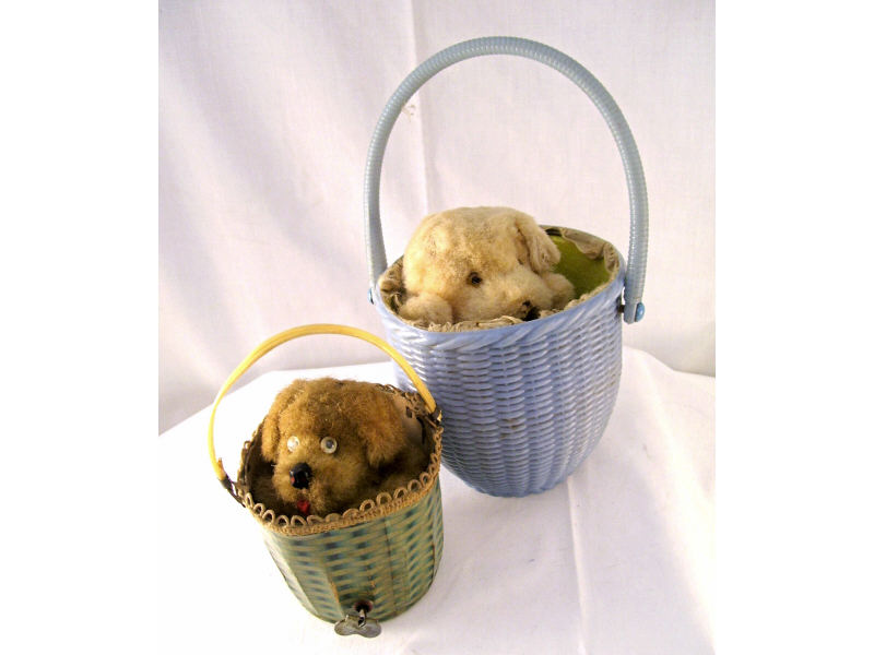 Appraisal: Mechanical Dogs in Baskets Windup figures include Dog in carboard