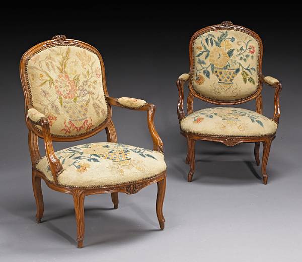 Appraisal: A pair of Louis XV walnut fauteuils second half th