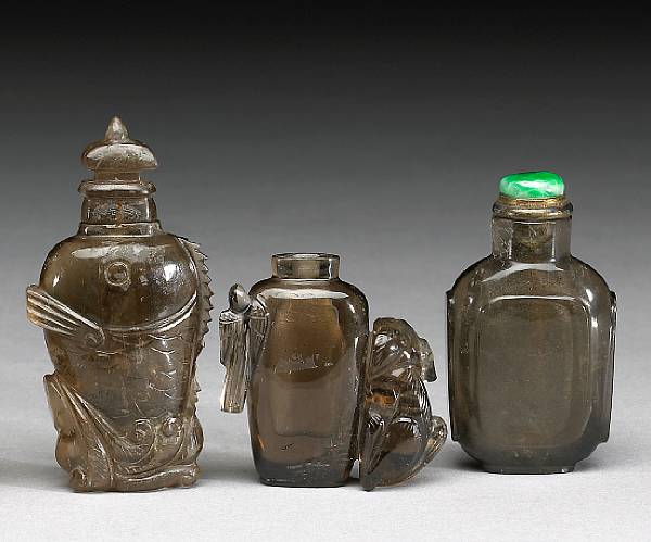 Appraisal: Three smokey quartz snuff bottles The first th century an