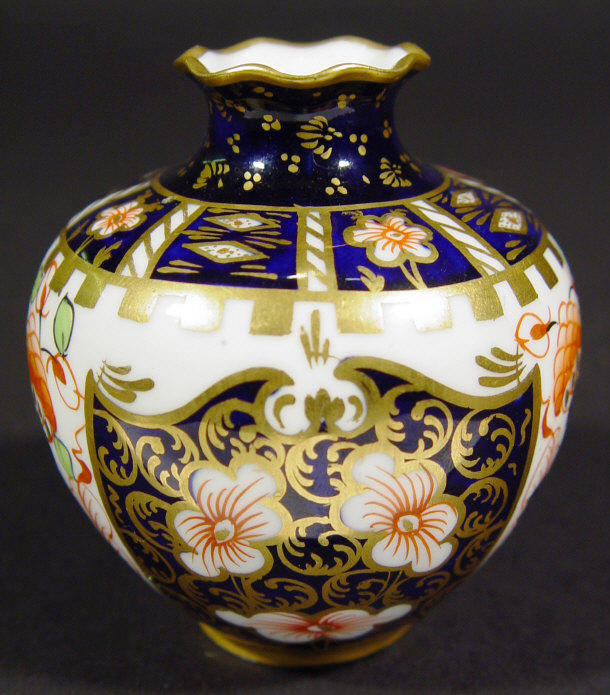 Appraisal: Royal Crown Derby china vase hand painted with Imari style