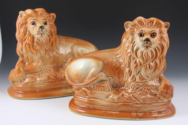 Appraisal: Pair of Staffordshire Lions th c expressive faces with inlaid