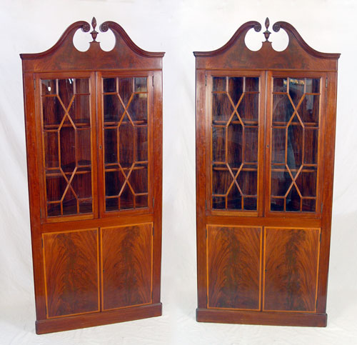 Appraisal: PAIR MAHOGANY CORNER CABINETS Banded fronts to the lower doors