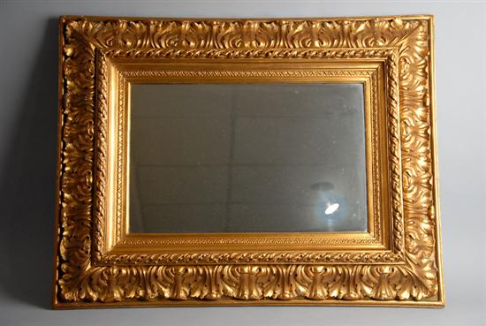 Appraisal: A Gilt Framed Wall Mirror having a deep foliate and