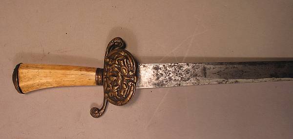 Appraisal: A composite hunting sword th century The inch single edged