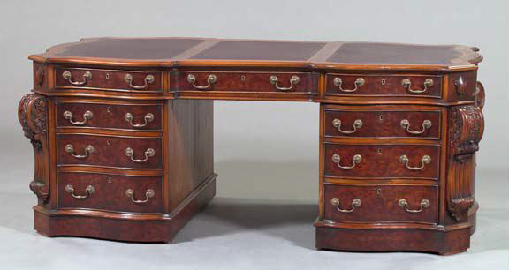 Appraisal: George III-Style Mahogany Partner's Desk the shaped rectangular top trisected