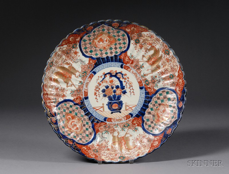 Appraisal: Ribbed Porcelain Charger Japan th century Imari ware designs of