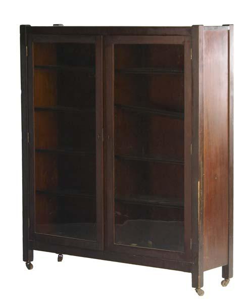 Appraisal: MAHOGANY TWO DOOR BOOKCASE With glass panes adjustable shelves and