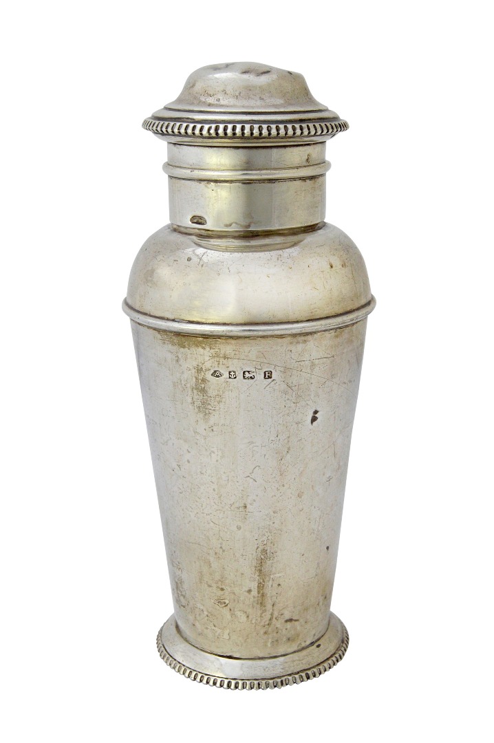 Appraisal: A silver cocktail shaker of tapered cylindrical form with decorated